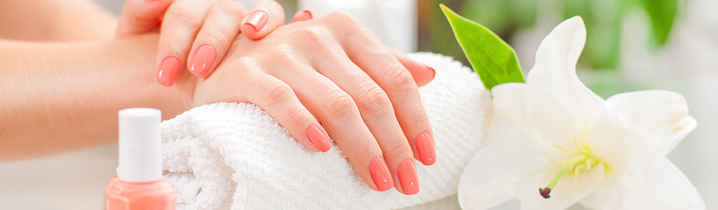 Beautiful woman's hands with perfect manicure at beauty salon.